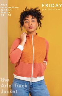 Model wearing an orange tracksuit jacket,  and jeans on a yellow and beige background with Friday Pattern Co. branding and text.