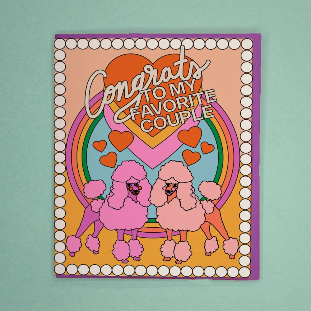 Card with pink poodles, rainbow, and hearts on a teal background