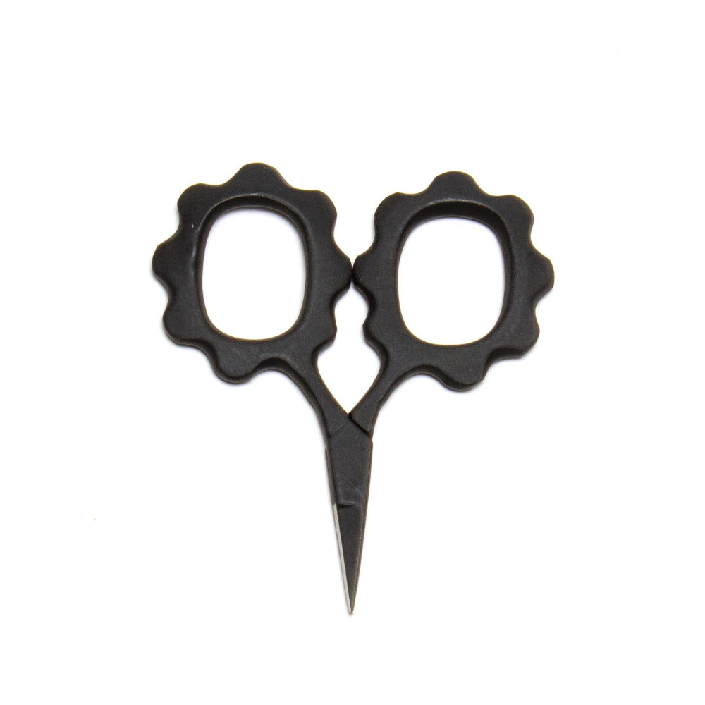Black scissors with decorative handles on a white background