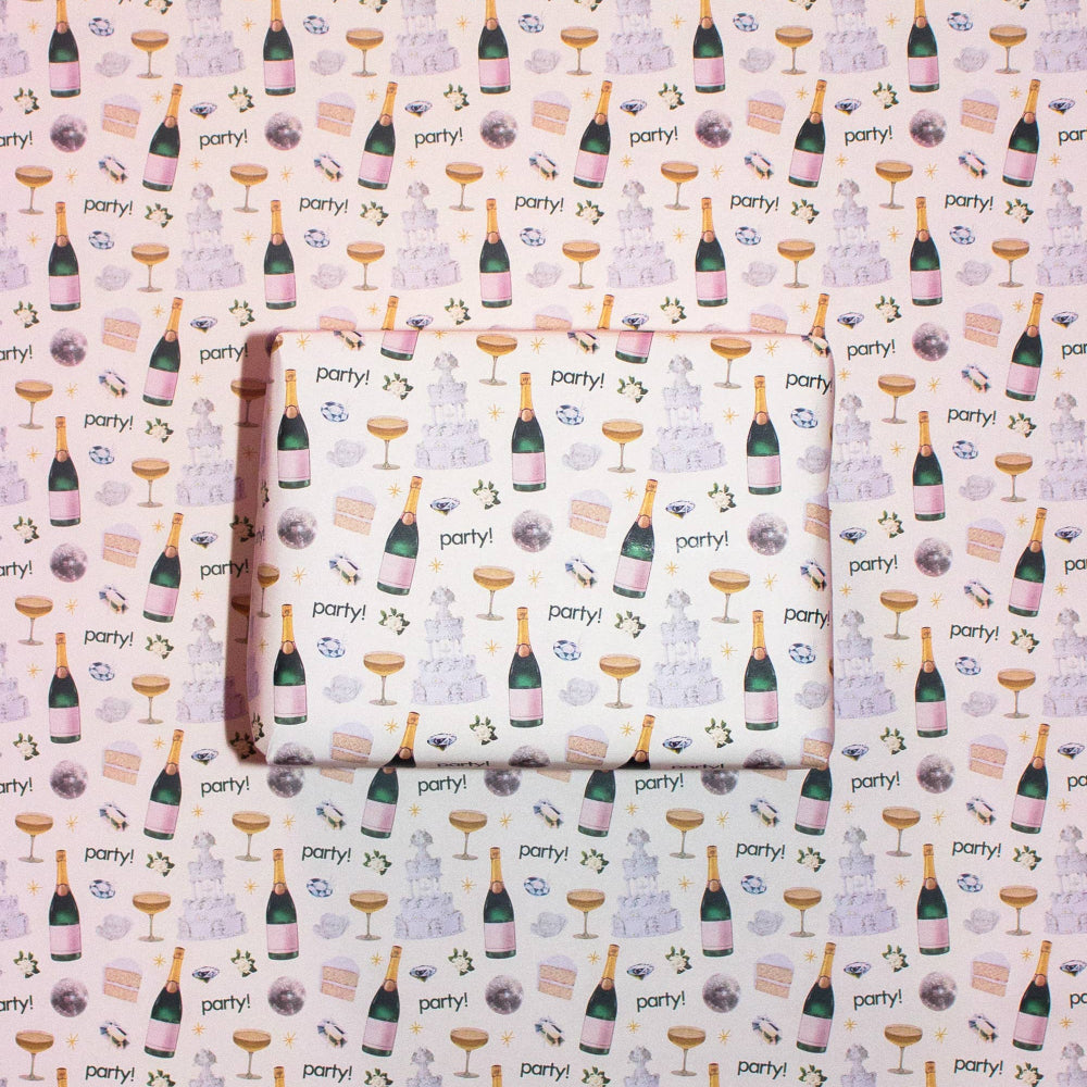 Patterned paper with champagne bottle, glass, and 'party!' text design.