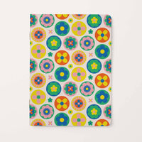 Notebook with colorful floral pattern on a white background
