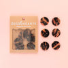 Packaged set of tortoiseshell patterned buttons with 'Sarah Hearts' branding on a pink background.
