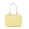 Yellow tote bag with white handle on a white background