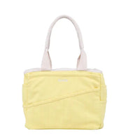 Yellow tote bag with white handle on a white background