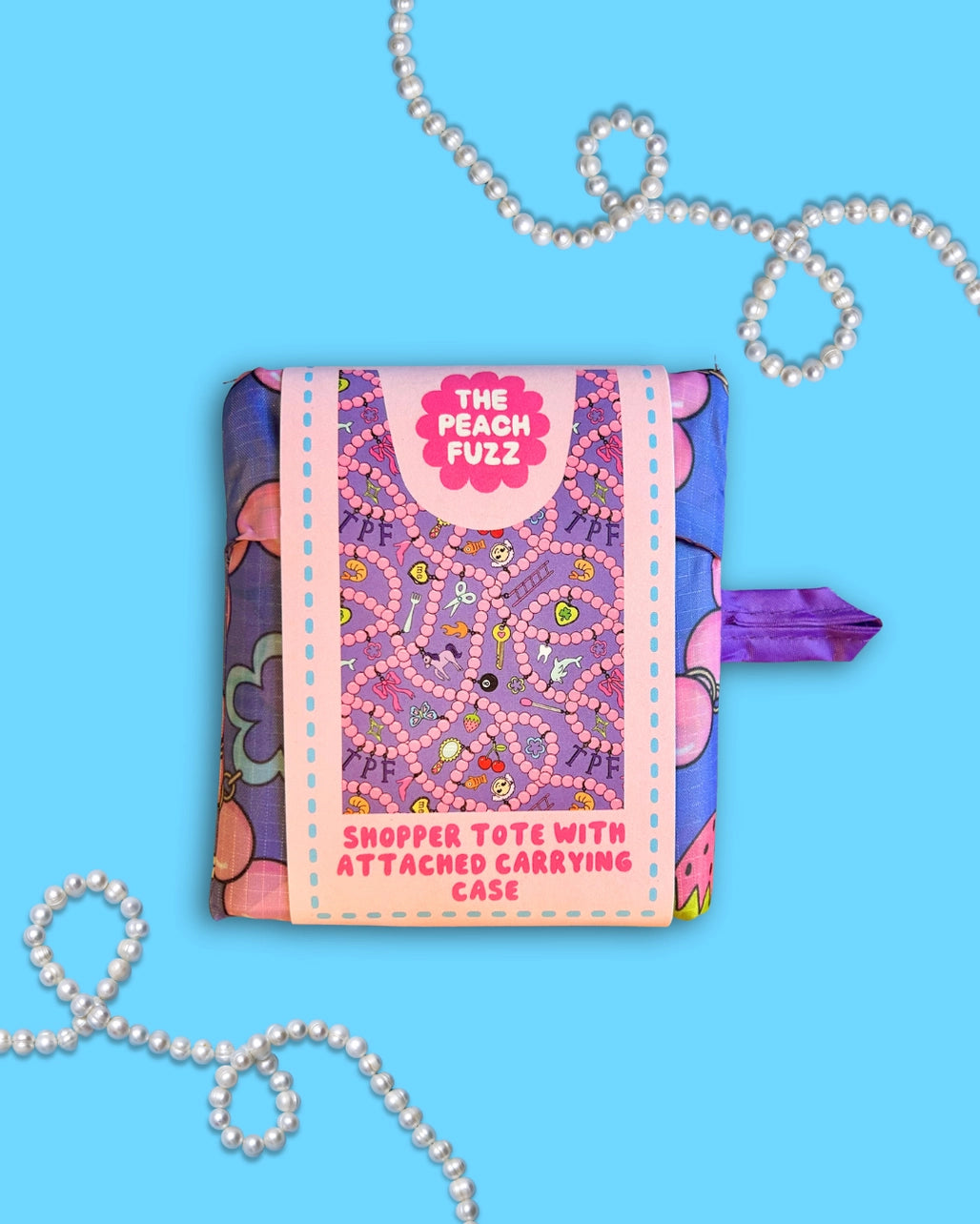 Colorful shopper tote with attached carrying case on a blue background