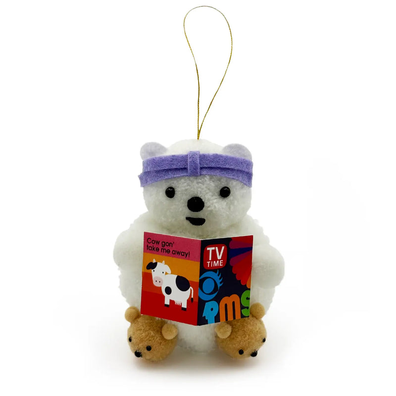 White bear holding a book and wearing bear slippers pom pom ornament on a white background.