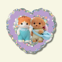Two small plush toys on a heart-shaped purple background with decorative border