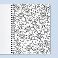 Coloring book with black floral patterns on a light blue background