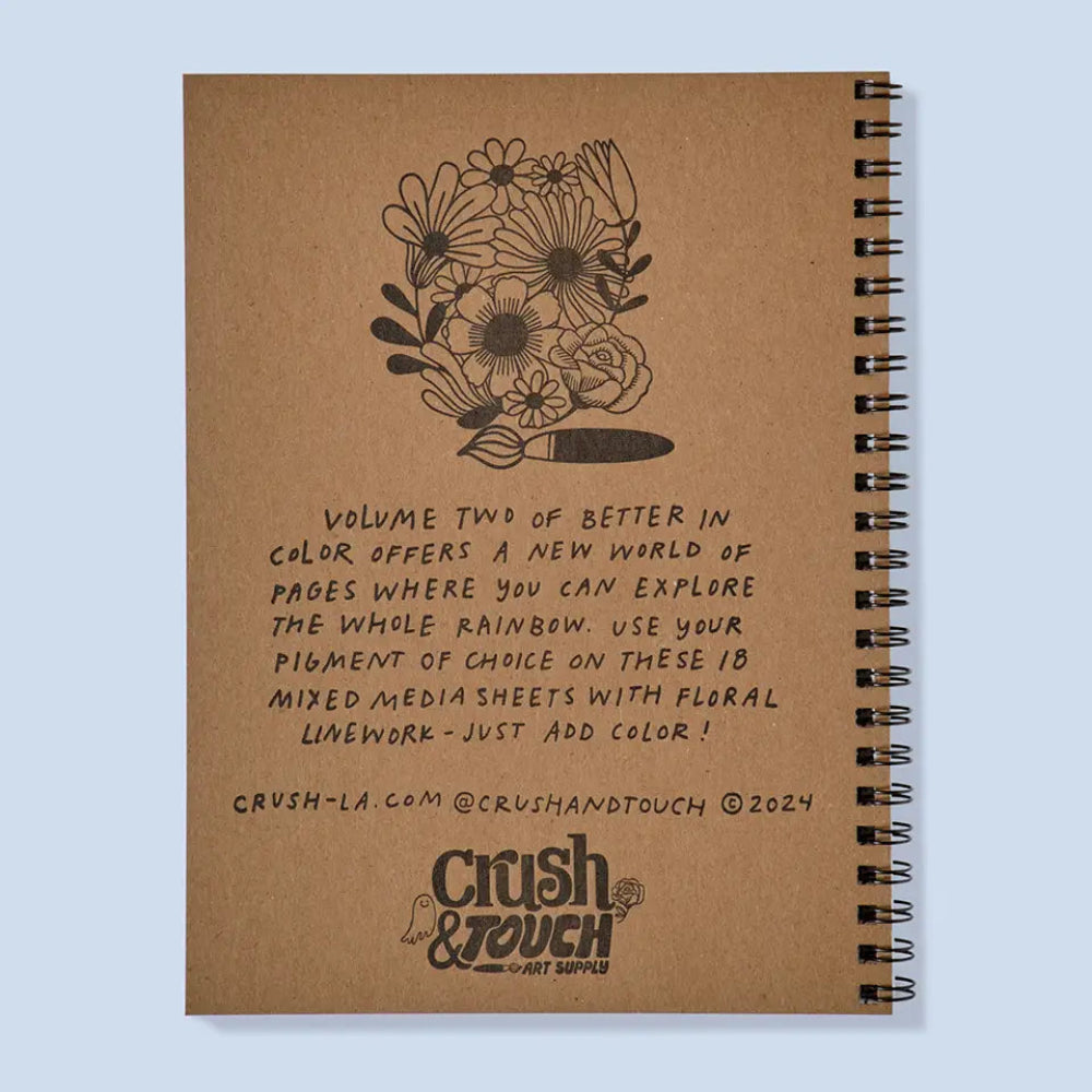 Brown notebook with floral design and text on a light blue background