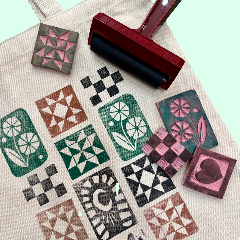 Set of rubber stamps with various patterns printed on a canvas tote bag.