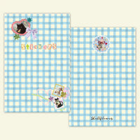 Two sheets of paper with a blue and white checkered pattern, featuring stickers and the brand 'Shellflower'.