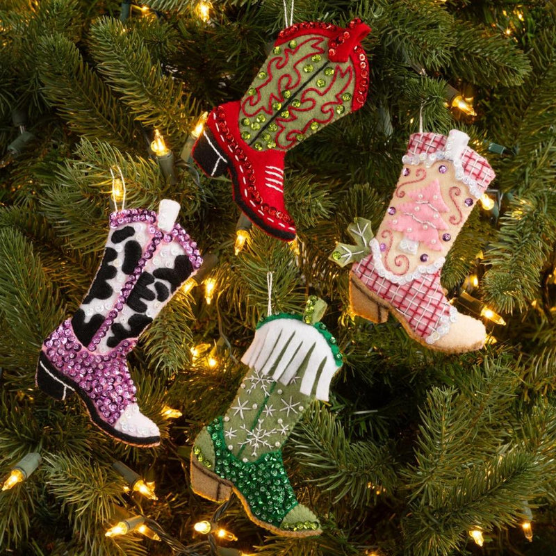 Decorative boot ornaments on a Christmas tree with lights.