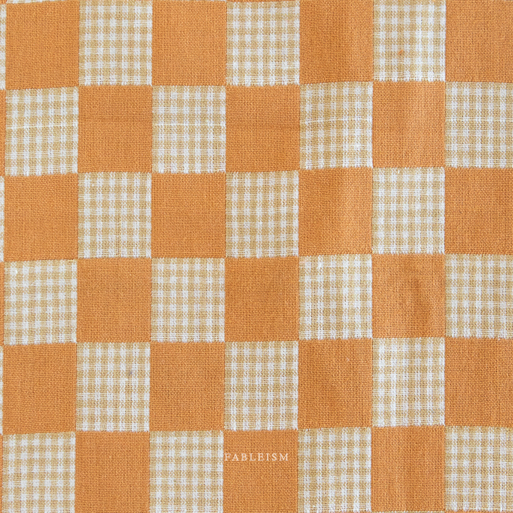 Checkered pattern with orange and beige squares