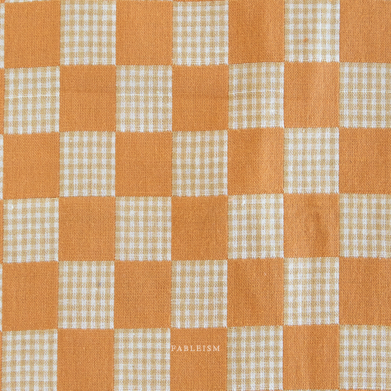 Checkered pattern with orange and beige squares