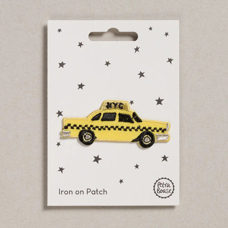 yellow taxi patch on white packaging 