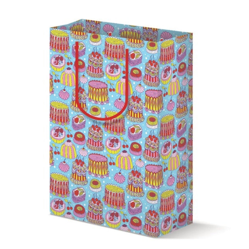 Colorful gift bag with cake pattern on a white background