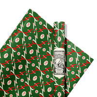 Green gift wrap with red and white ribbons and candy canes on a white background