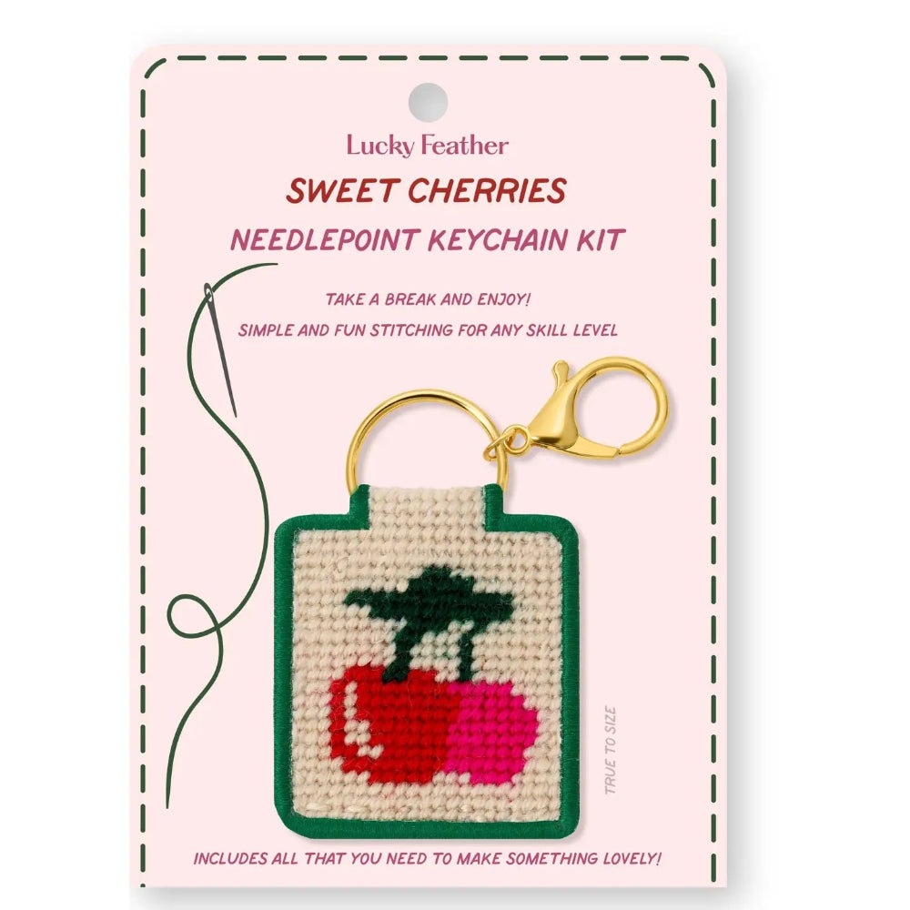 Lucky Feather Sweet Cherries needlepoint keychain kit on a pink card