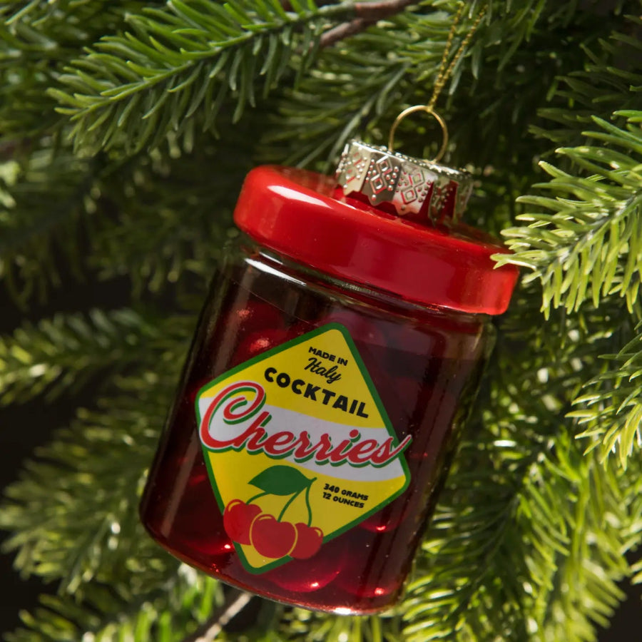 Decorative ornament shaped like a jar of cocktail cherries on a Christmas tree.