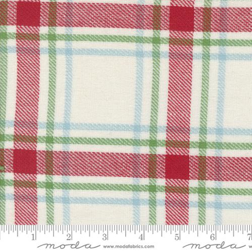 Plaid fabric with red, green, and blue pattern on a white background