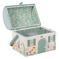 Decorative sewing box with floral and garden-themed design on a white background