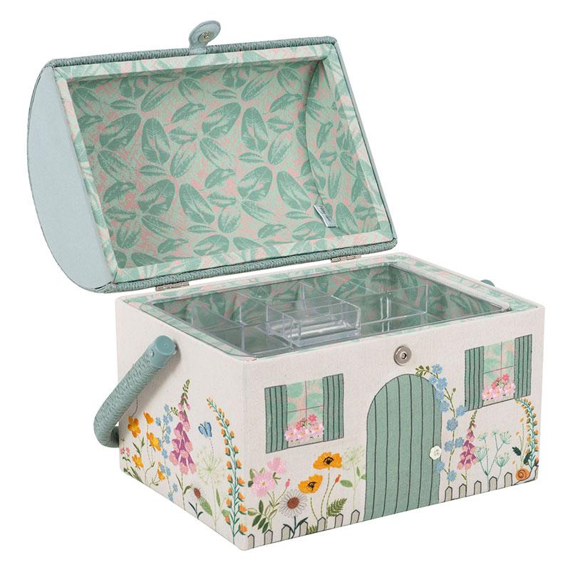 Decorative sewing box with floral and garden-themed design on a white background
