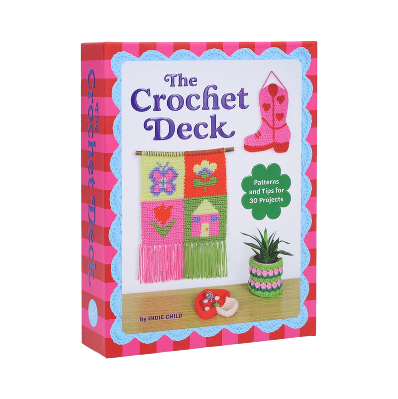 A pink box with the words "The Crochet Deck" printed on the front, with images of bright and fun crochet projects