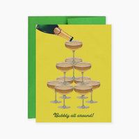 Greeting card with champagne being poured into a tower of glasses on a yellow background