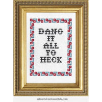 Cross-stitched phrase 'Dang it all to heck' in a decorative frame with geometric border.