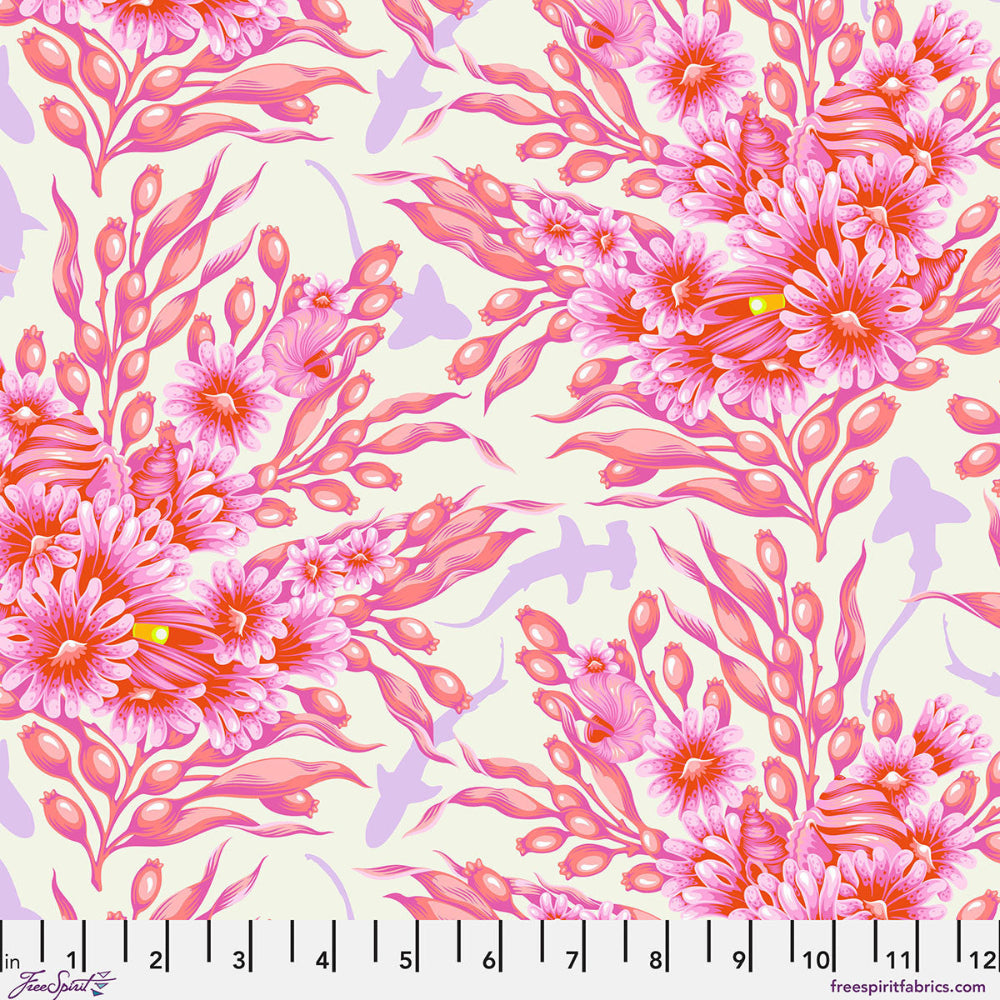 Pink floral and leaf pattern with shadows of sharks in between on a light background with a ruler at the bottom.