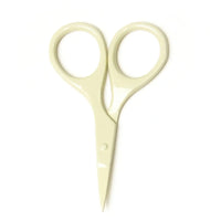 Pair of beige scissors on a white background