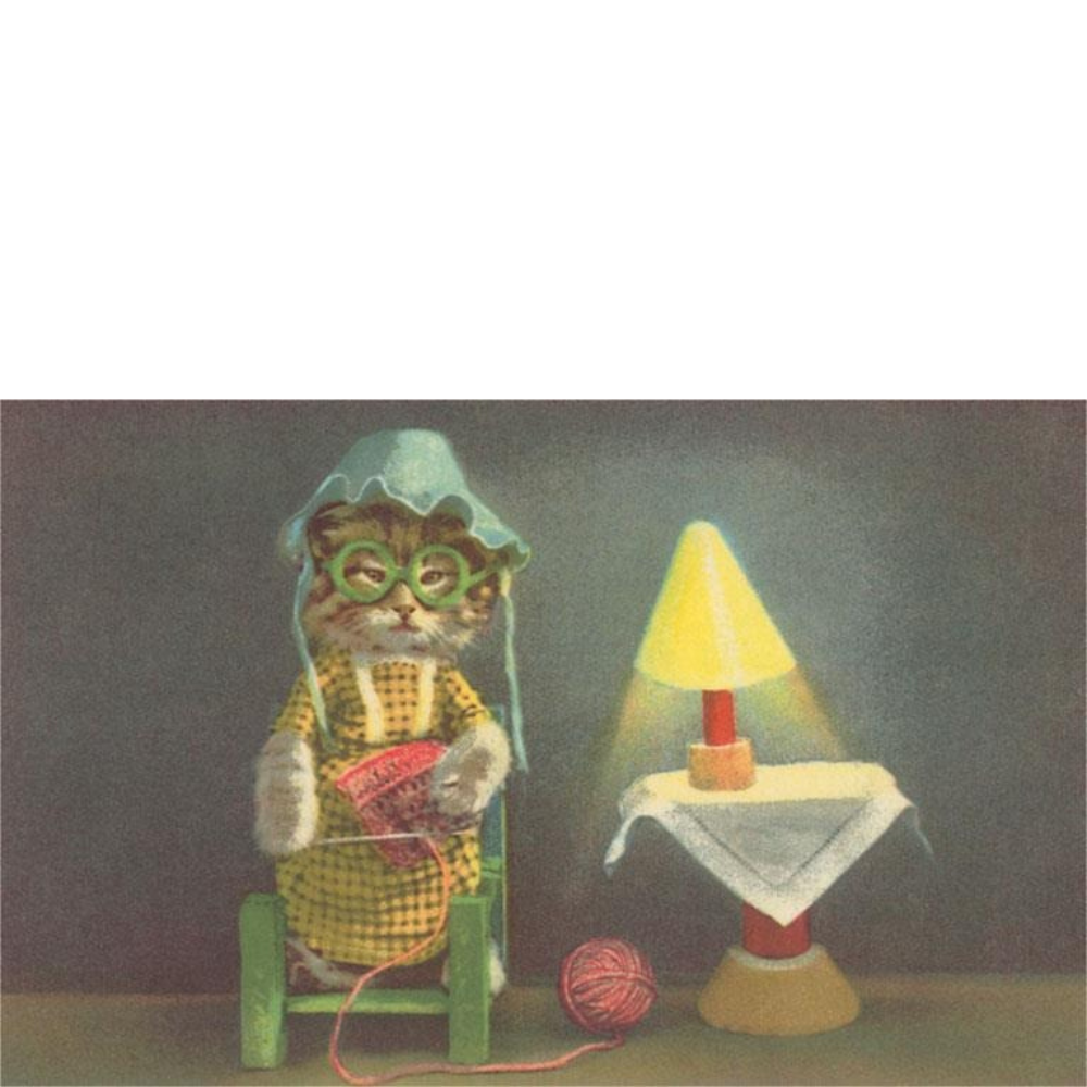 Cat dressed in bonnet, dress and glasses knitting from ball of yarn with a yellow light on small table next to chair
