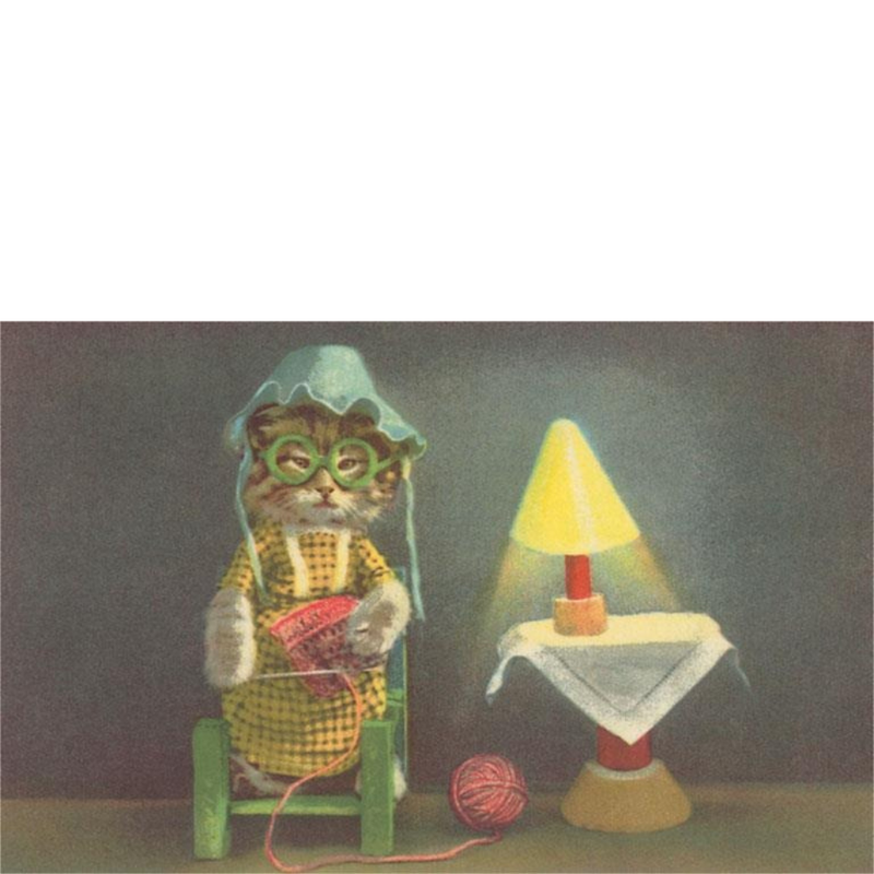 Cat dressed in bonnet, dress and glasses knitting from ball of yarn with a yellow light on small table next to chair