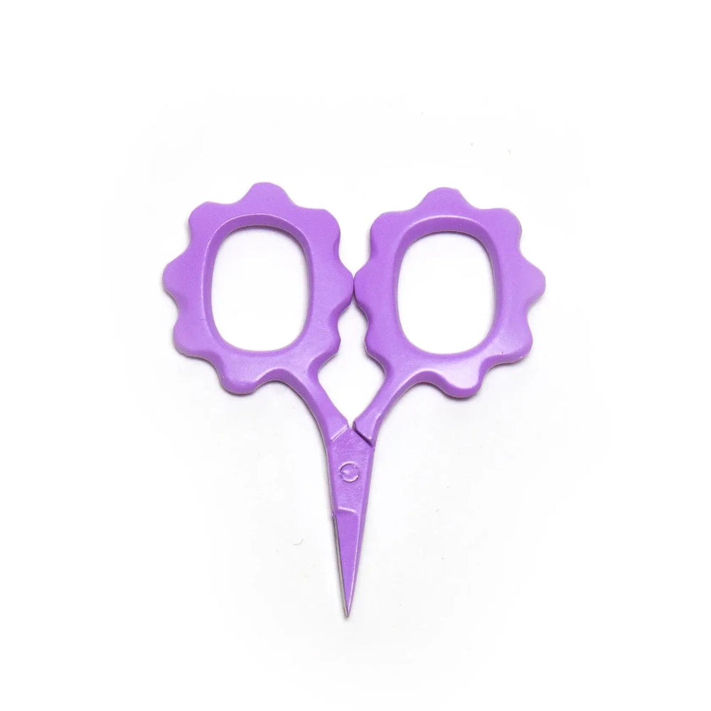 Purple scissors with flower-shaped handles on a white background