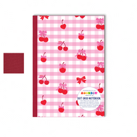 Notebook with pink checkered pattern and red cherries on a white background