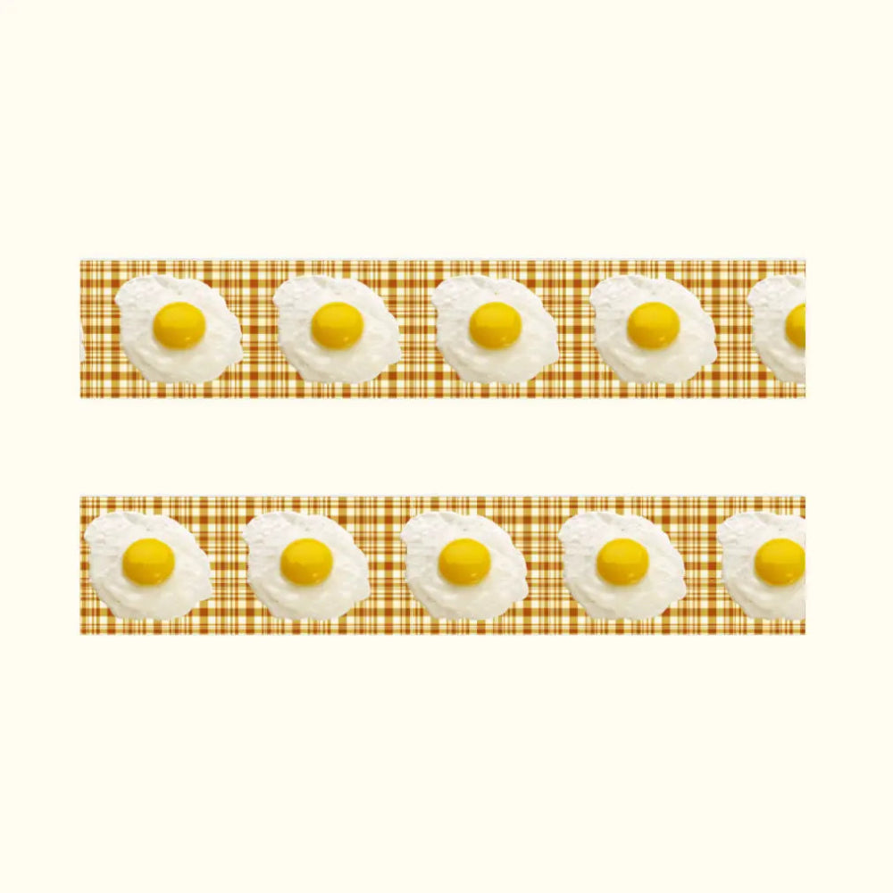 Strips of washi tape with fried eggs on a checkered background