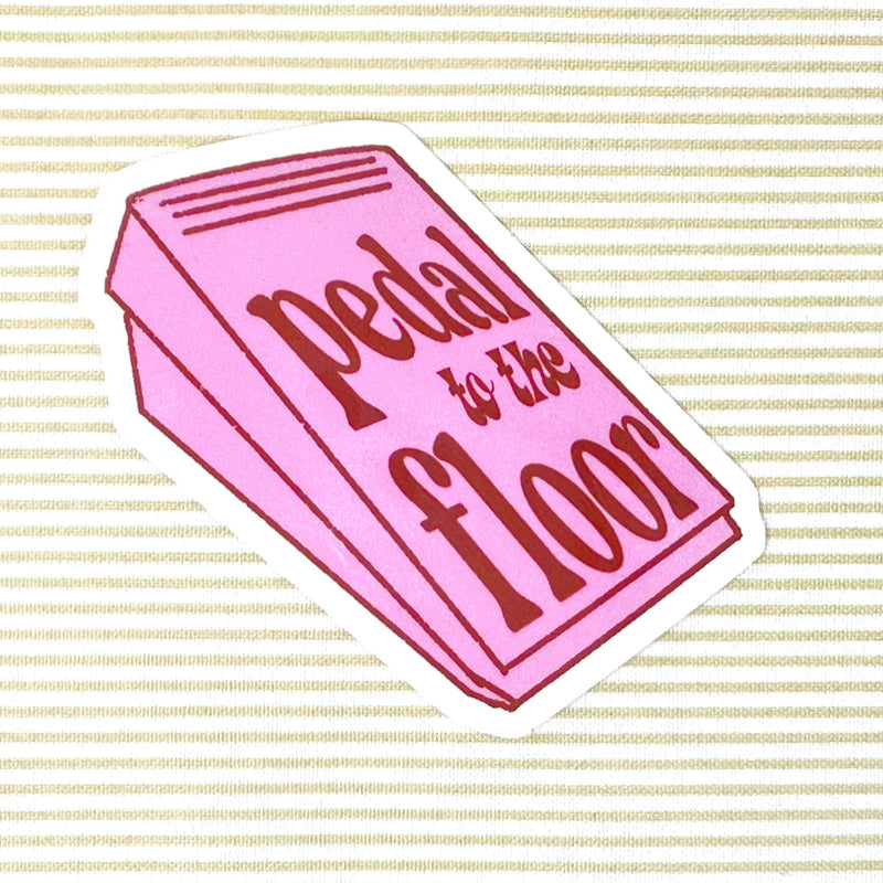 Pink sewing pedal with 'Pedal to the Floor' text on a striped background