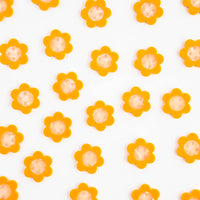 Pattern of yellow flowers with orange centers on a white background