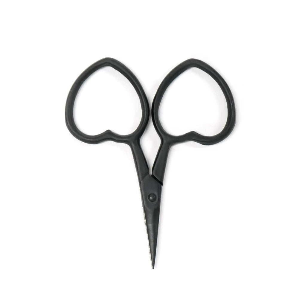 Black scissors with heart-shaped handles on a white background