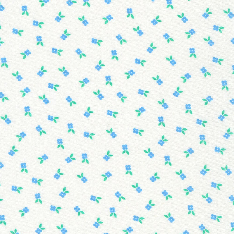 Pattern of small blue flowers with green leaves on a white background