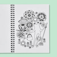 Spiral-bound coloring book with a black and white illustration of a gardener froggy surrounded by flowers on a light green background.