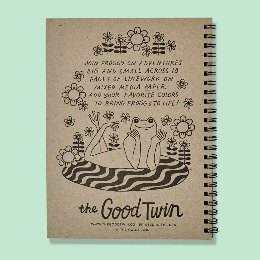 Notebook with a frog illustration and text on a light green background