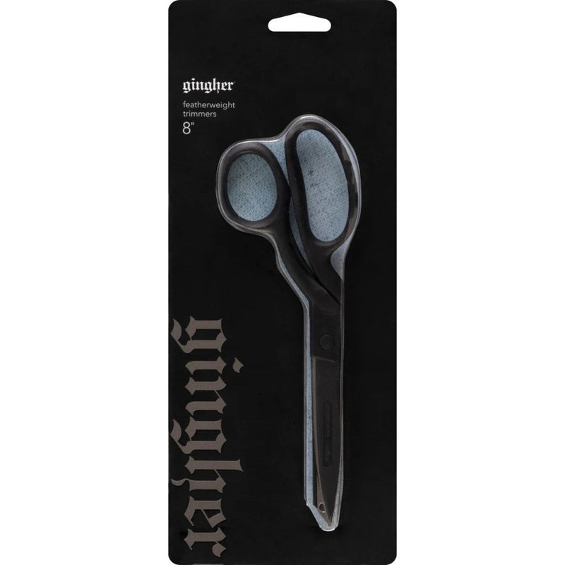 Ginther featherweight trimmers on a black packaging background