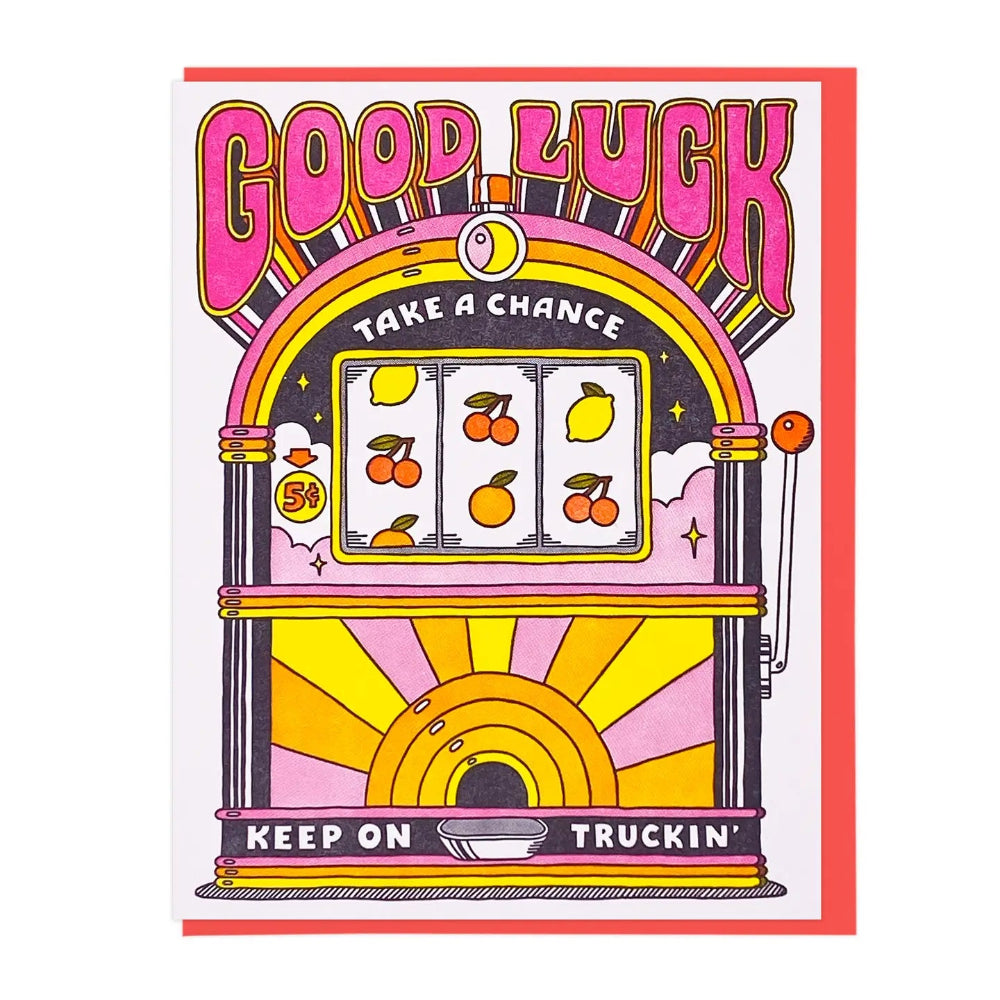 A greeting card featuring a retro-style slot machine illustration with the words 'GOOD LUCK', 'TAKE A CHANCE', and 'KEEP ON TRUCKIN''. The card has a white background and a colorful slot machine illustration in pink, yellow, orange, and black.