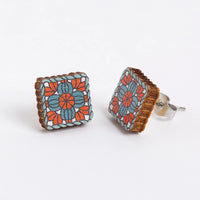 Square floral patterned granny square earrings on a white background
