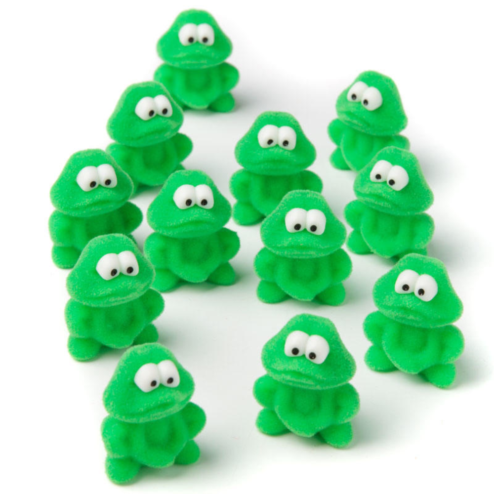 Small fuzzy green frog miniatures with white eyes arranged on a plain white background.