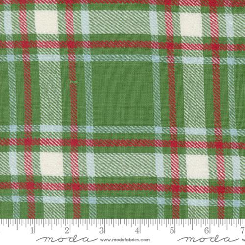 Green plaid fabric with red and white accents