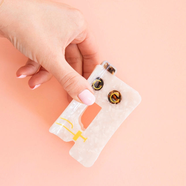 Sewing machine hair claw
