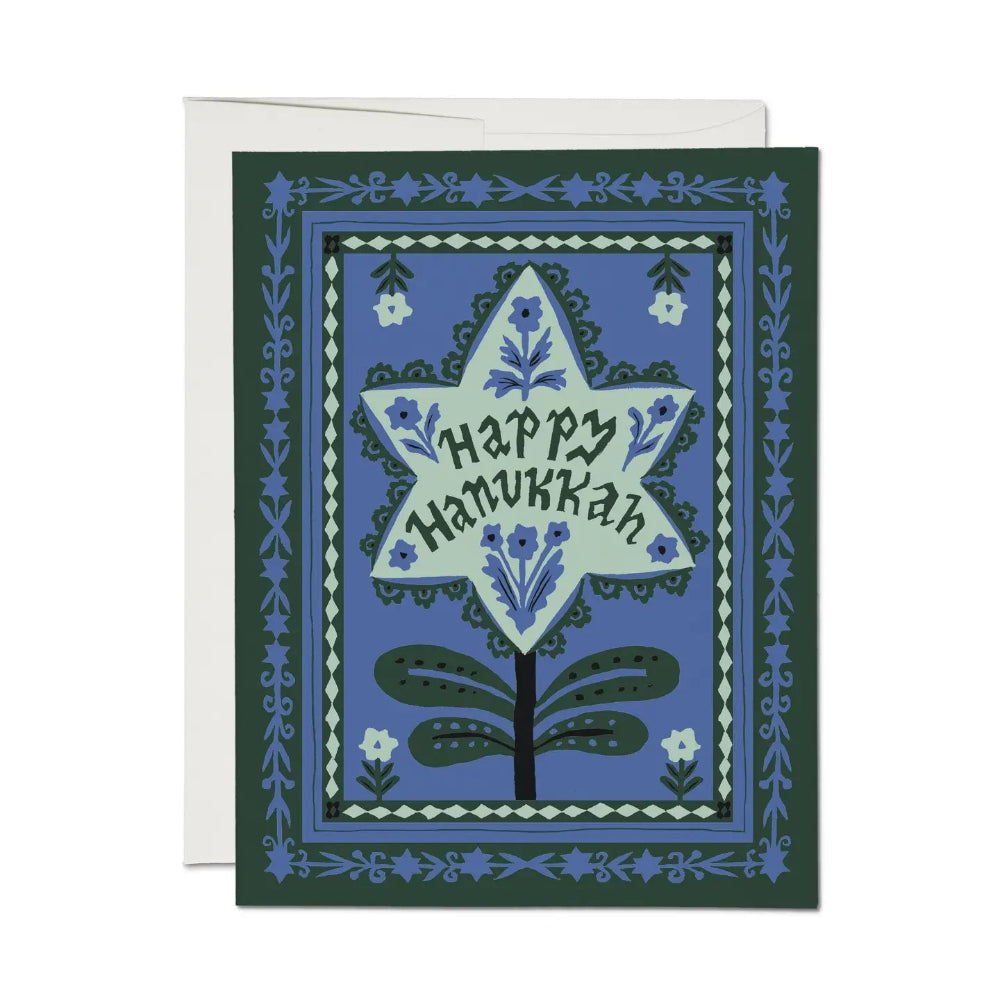 Greeting card with 'Happy Hanukkah' design on a blue background