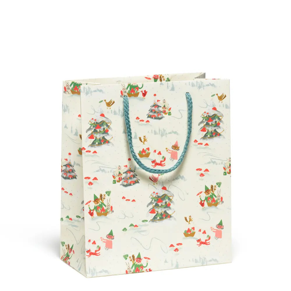 White bag with blue handles with images of Christmas trees with mushrooms and forest animals on a white background.